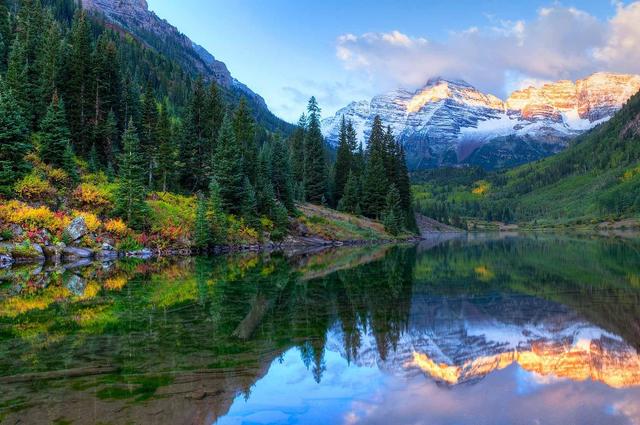 A photo of pristine Colorado mountains and a lake