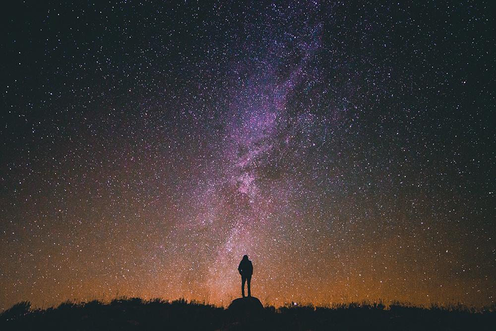 Woman standing next to stars